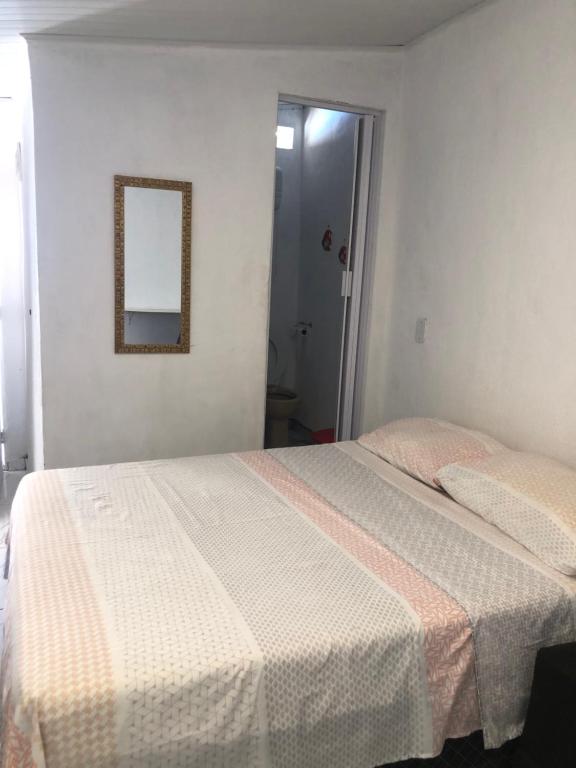 En eller flere senge i et værelse på Arraial suíte