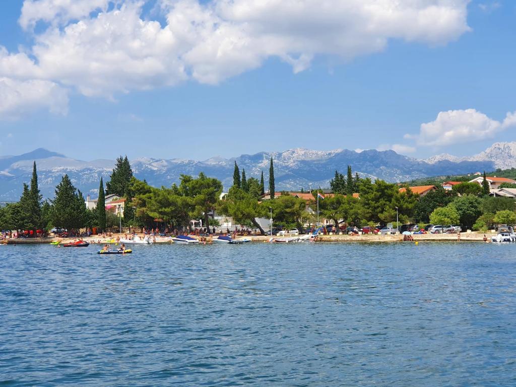 a view of a body of water with a beach at Small apartment near the beach in Gornji Karin in Anić
