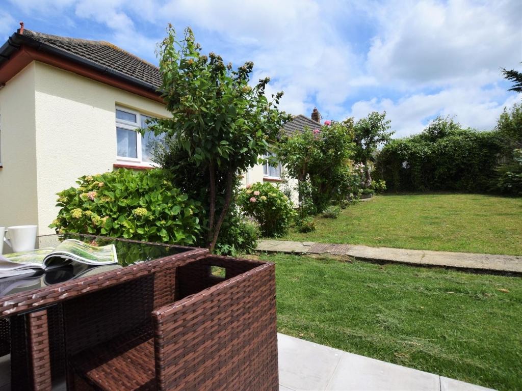a house with a tree in a yard at 2 bed in Bude 58818 in Bude