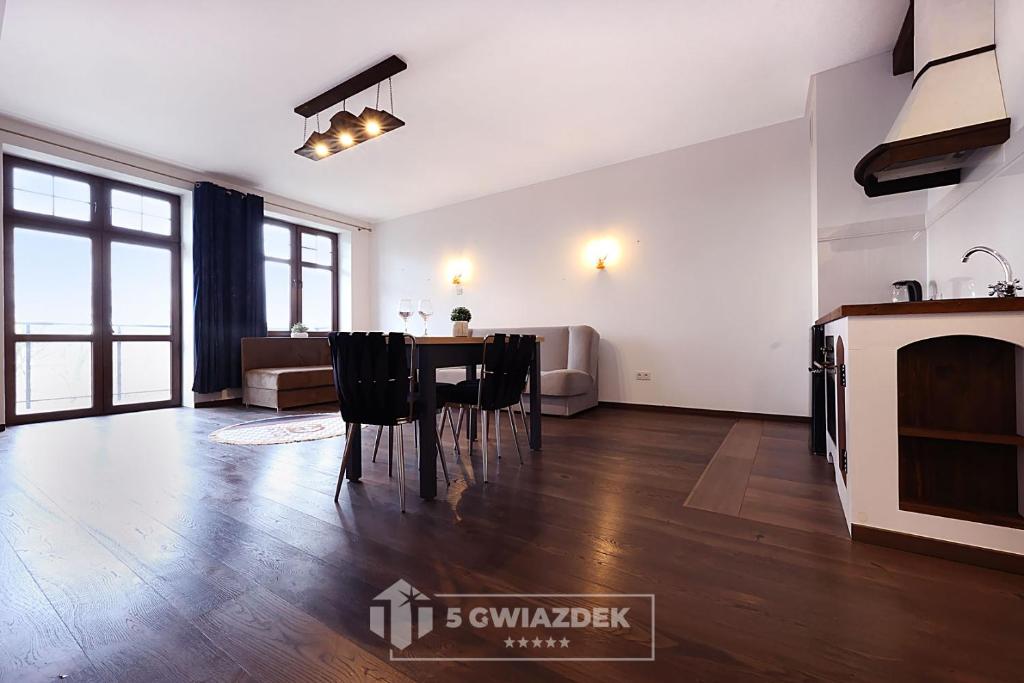 a living room with a table and a couch at apartament 34 in Szczecinek