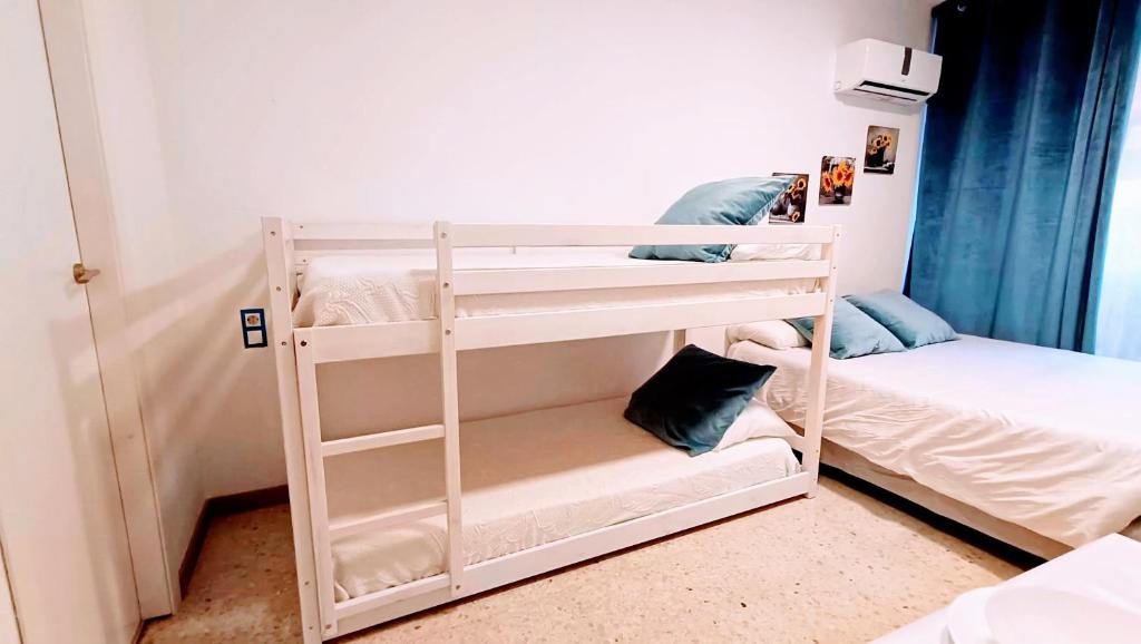Postel nebo postele na pokoji v ubytování Hostal Estudios