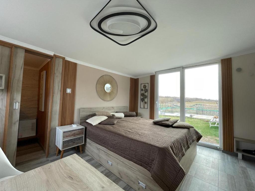 Ένα ή περισσότερα κρεβάτια σε δωμάτιο στο Diamona Lux Spa Apartman