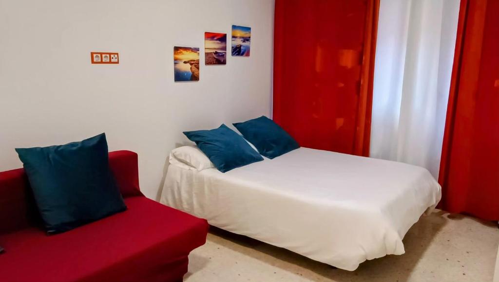 Postel nebo postele na pokoji v ubytování Hostal Estudios