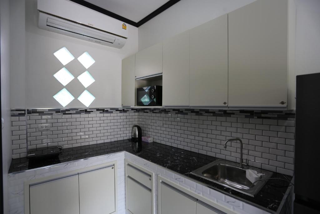 Kuchyň nebo kuchyňský kout v ubytování MB House Resort