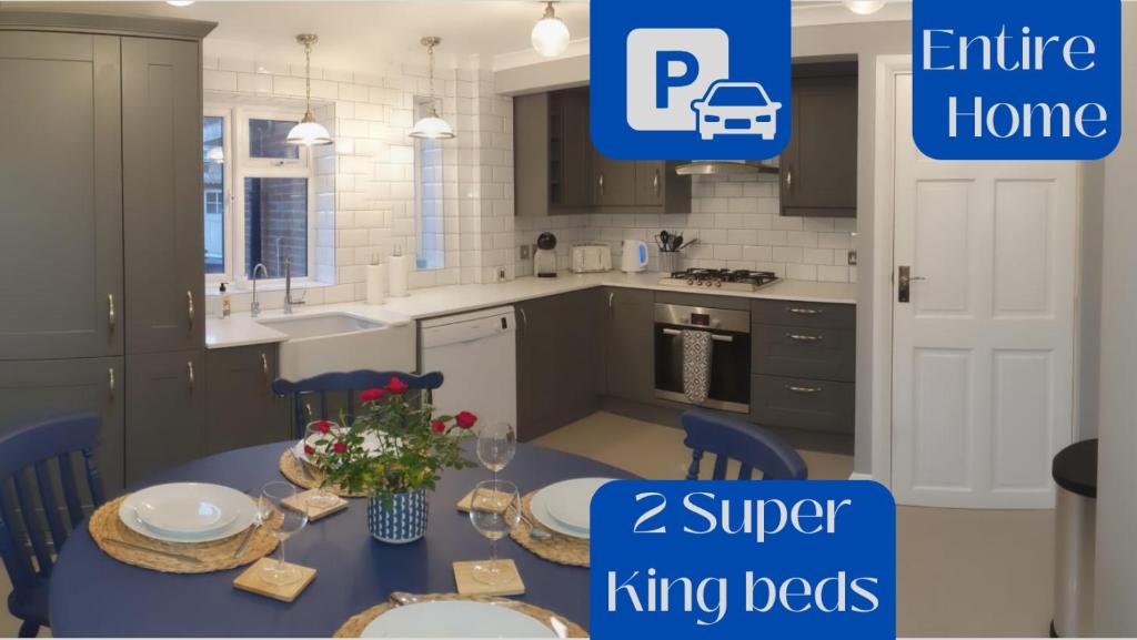 an image of a kitchen with a table and chairs at Pinewood Studios, Iver near Heathrow and Windsor XL 75sqm 2 King Bed Flat with 2 Parking Spaces in Buckinghamshire