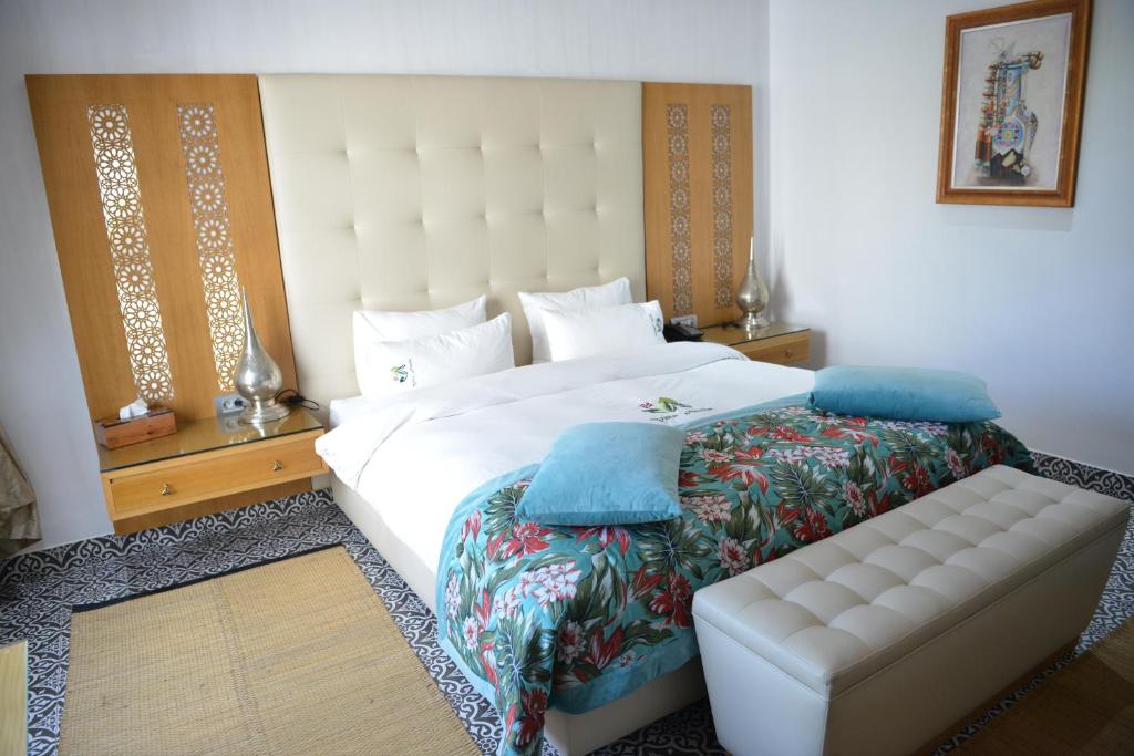 Postel nebo postele na pokoji v ubytování Aralia Boutique Hôtel
