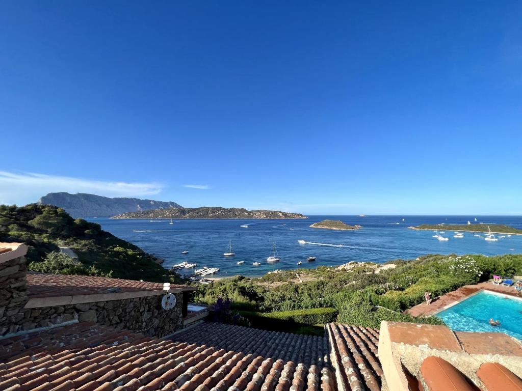 a view of the ocean from a house at Punta Est Trilocale meravigliosa Vista Mare in Capo Coda Cavallo