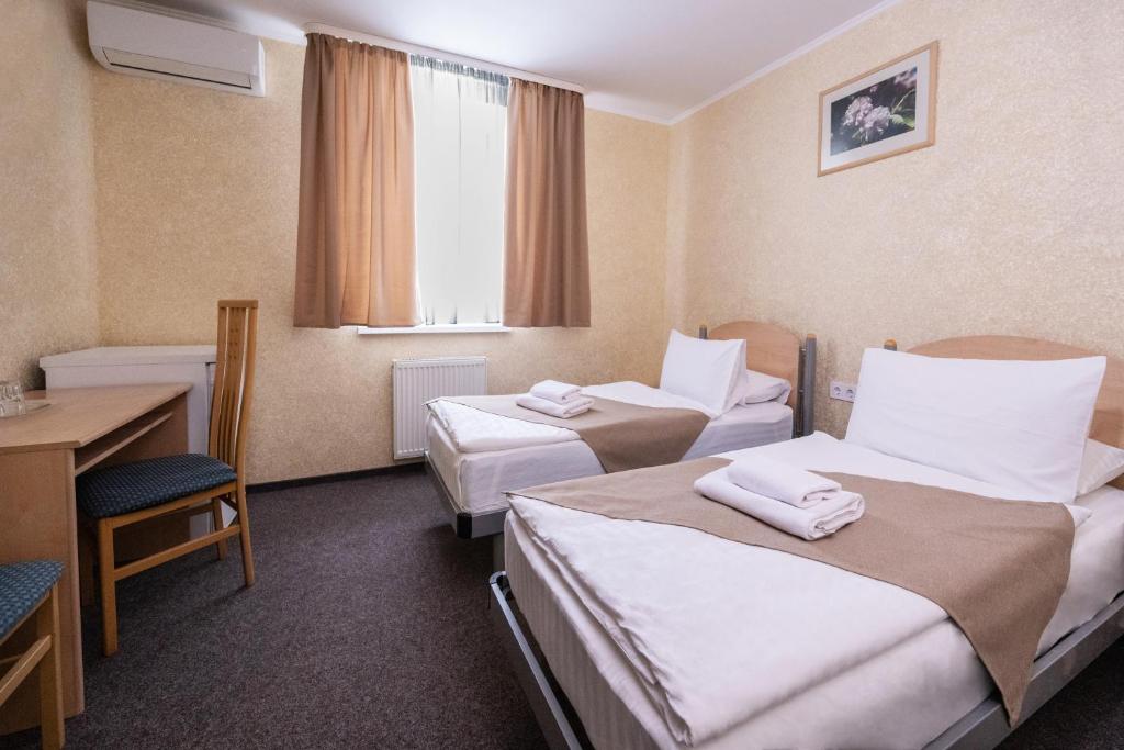 Postel nebo postele na pokoji v ubytování Hotel Express Корпус 2