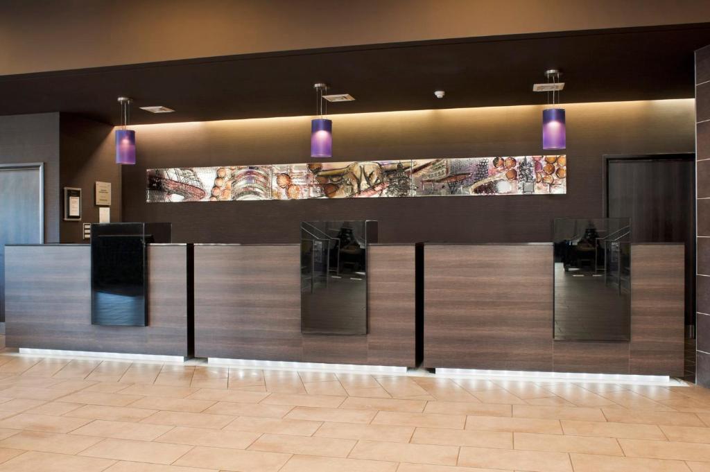 a food counter in a restaurant with purple lights at Crowne Plaza Birmingham City, an IHG Hotel in Birmingham