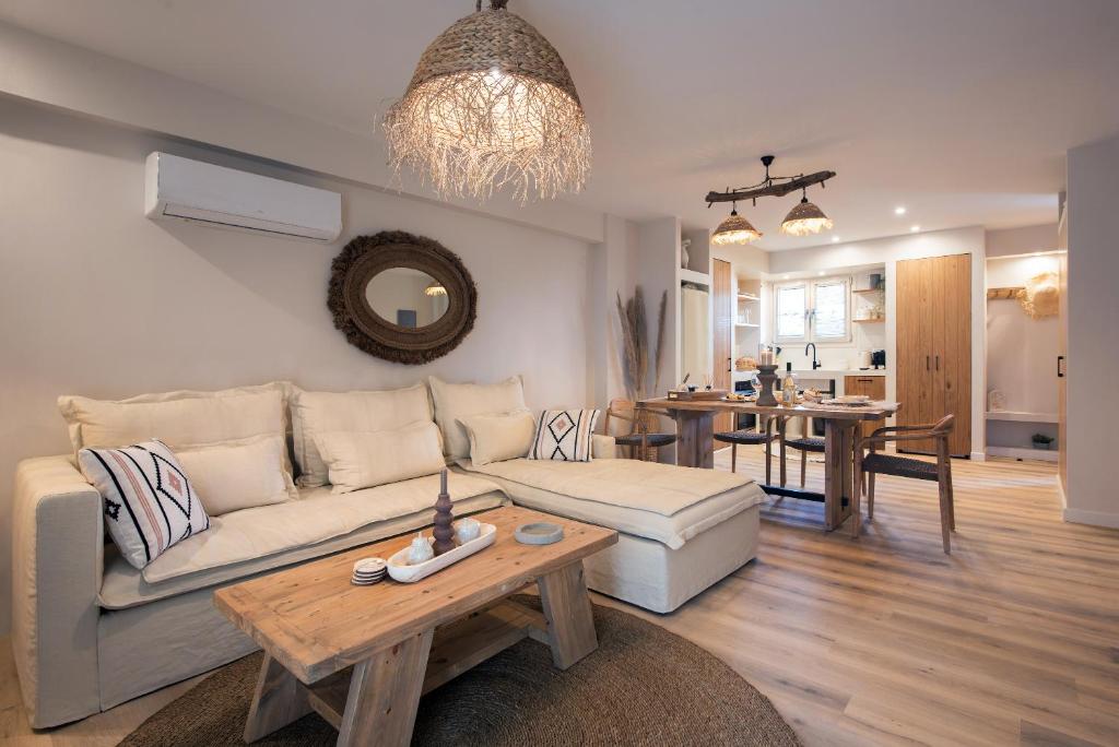 a living room with a couch and a table at EF apartment in Corfu Town
