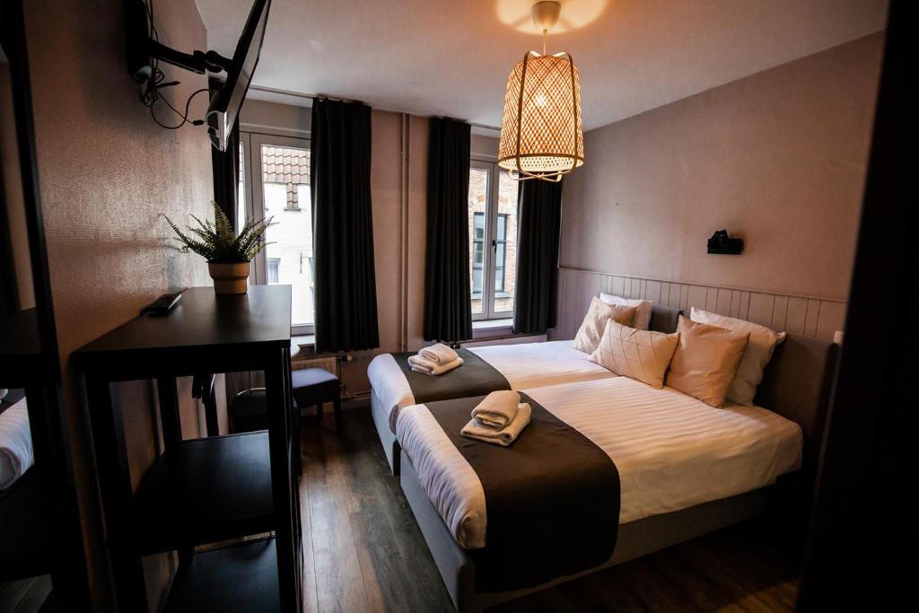 Postel nebo postele na pokoji v ubytování Hotel Rose Red