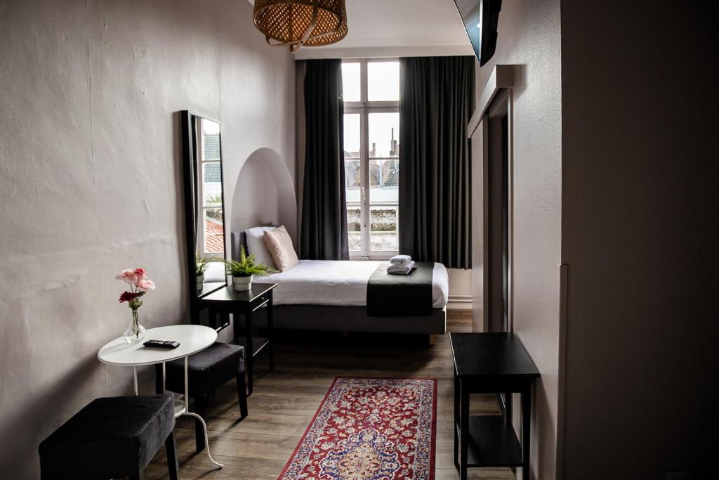 Postel nebo postele na pokoji v ubytování Hotel Rose Red