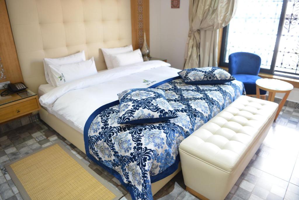 Postel nebo postele na pokoji v ubytování Aralia Boutique Hôtel