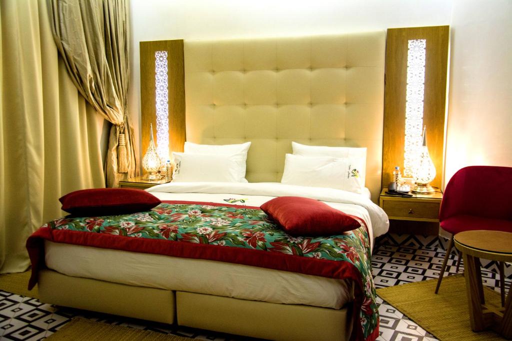 Postel nebo postele na pokoji v ubytování Aralia Boutique Hôtel