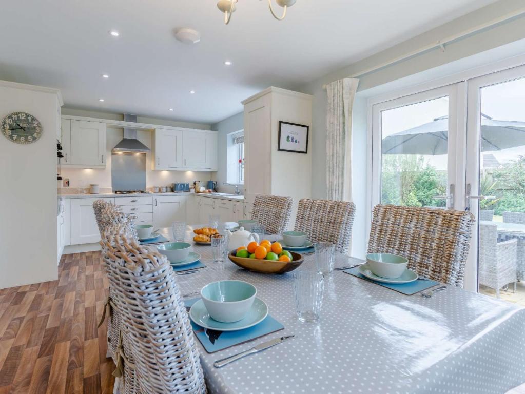 a kitchen with a table with a bowl of fruit on it at 4 Bed in Westward Ho 85367 in Westward Ho