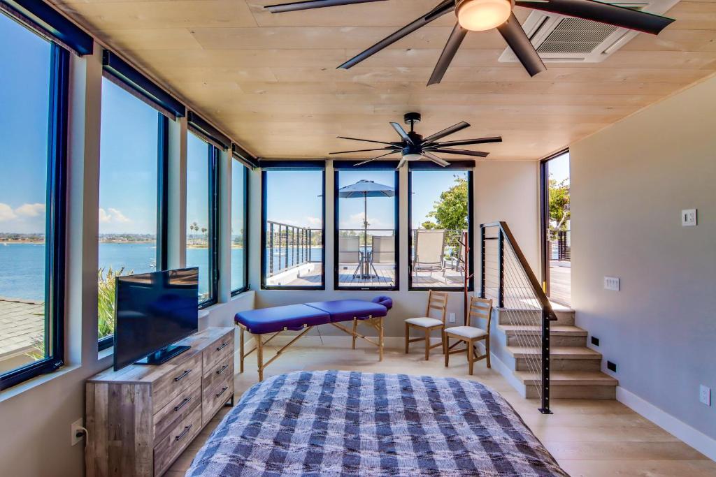 a bedroom with a view of the ocean at Boardwalk 6 in San Diego