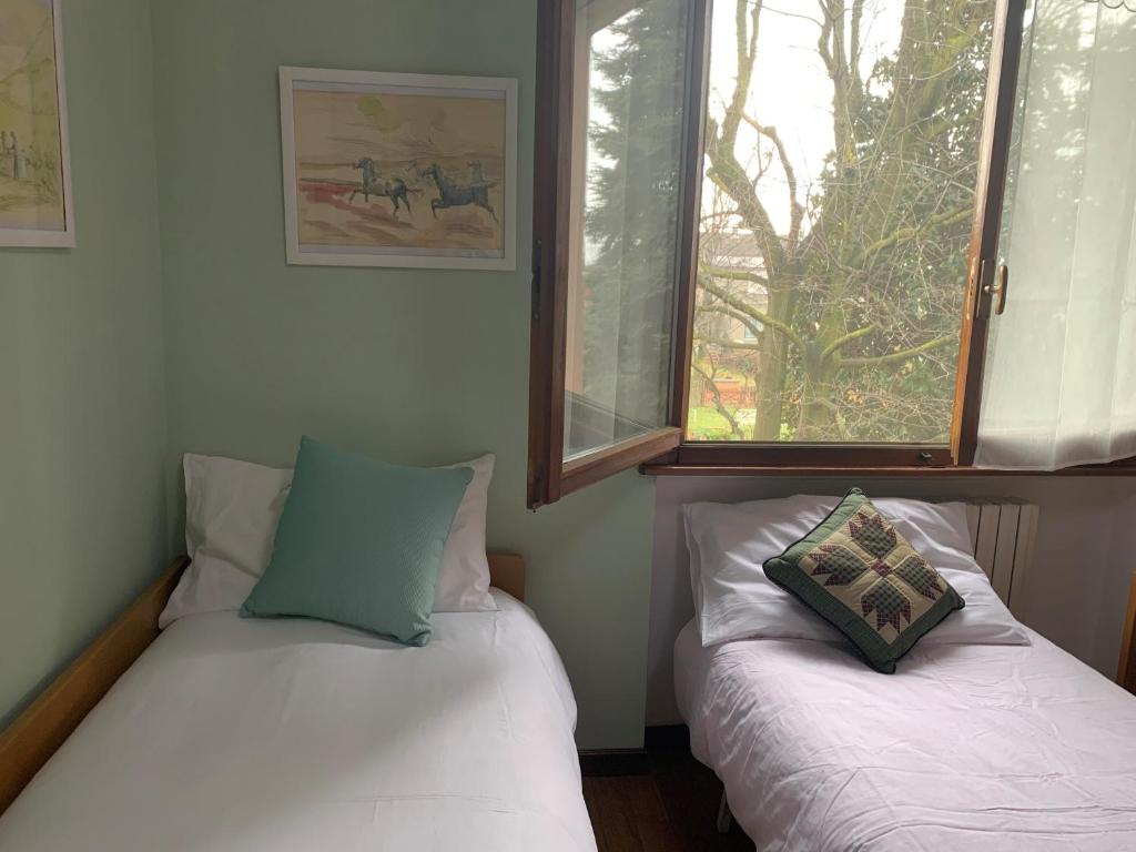 Postel nebo postele na pokoji v ubytování Casa Carlotta - Milan Expo
