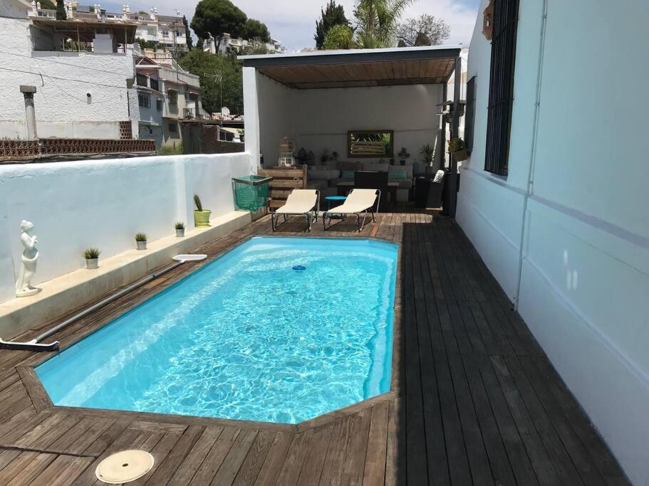 een zwembad bovenop een huis bij Pedregalejo Gabriel y Galan 3 in Málaga