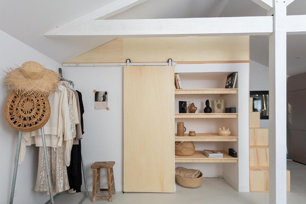 a room with a loft bed and a closet at PYLA: Nice creative studio 200 m from the beach in La Teste-de-Buch