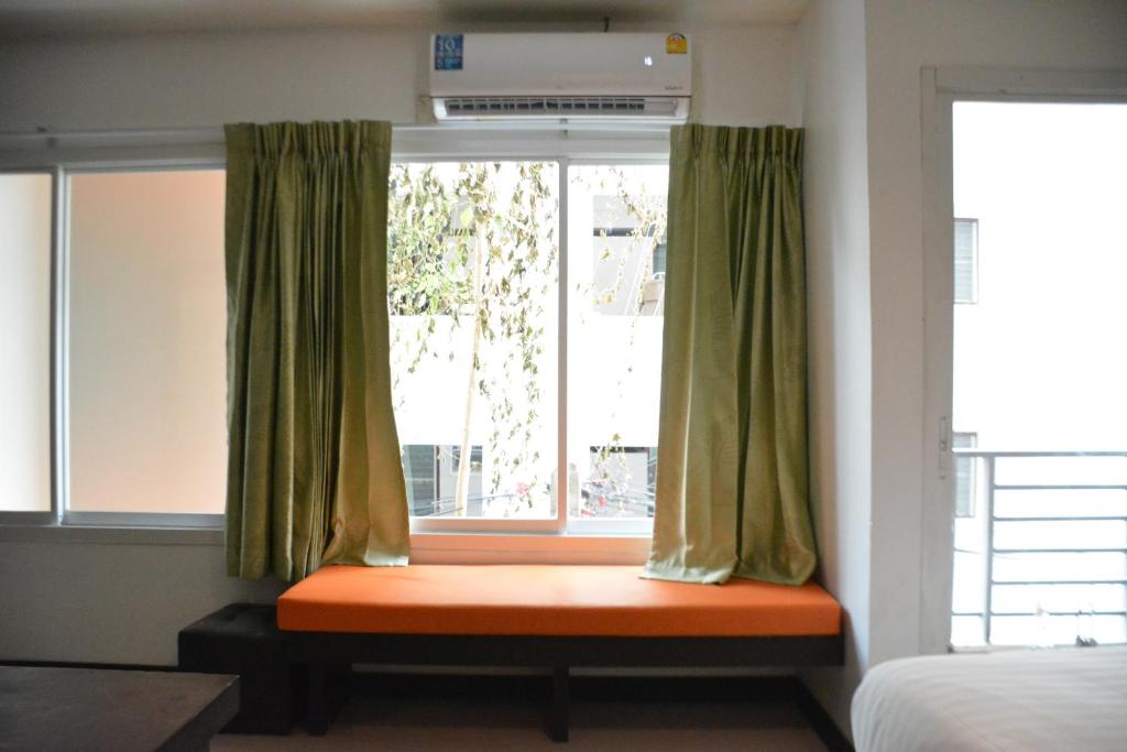 Postel nebo postele na pokoji v ubytování Zephyr Grand Hotel