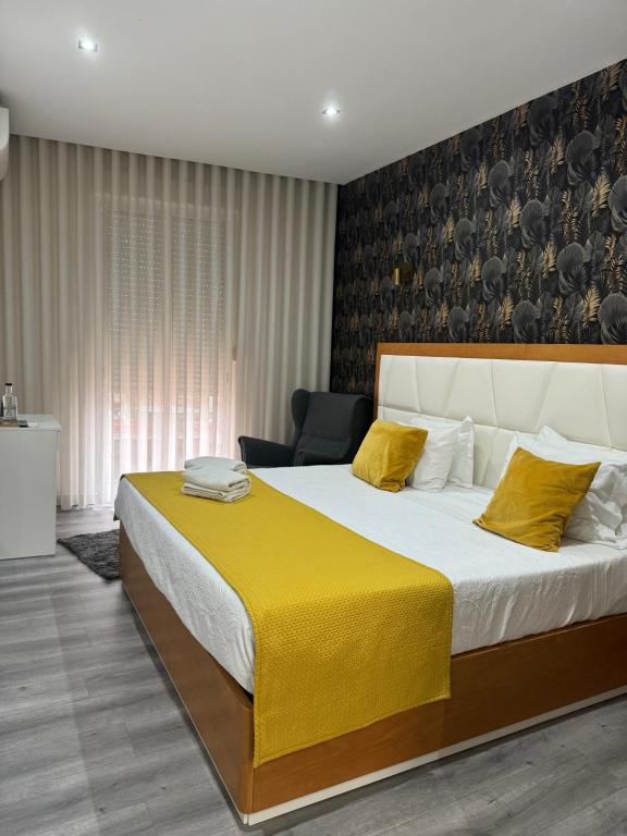 Llit o llits en una habitació de GuestHouse Marquês