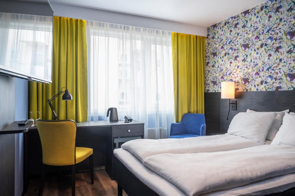 Postel nebo postele na pokoji v ubytování Thon Hotel Tromsø