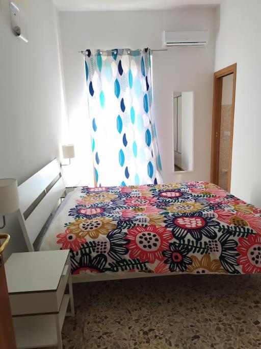 Postel nebo postele na pokoji v ubytování Casa Orchidea Sortino