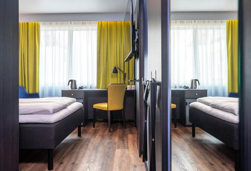 Postel nebo postele na pokoji v ubytování Thon Hotel Tromsø