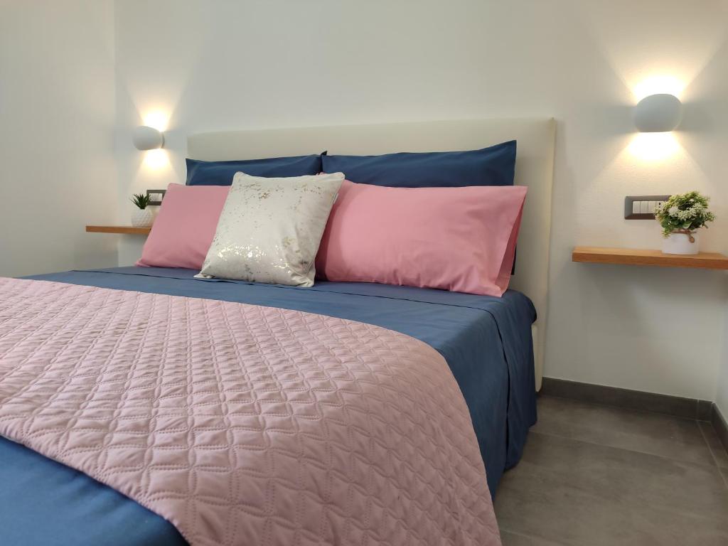 Postel nebo postele na pokoji v ubytování Il Sogno di Giò