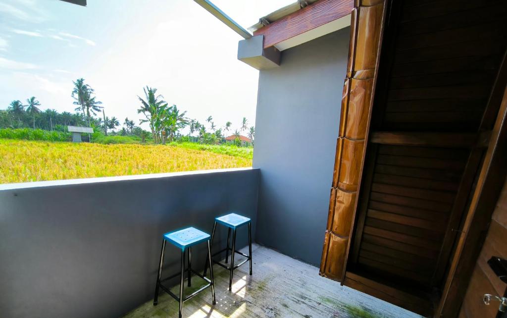 Balkón nebo terasa v ubytování Eling Ubud Guesthouse