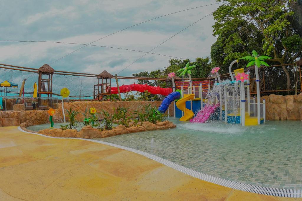 a water park with a water slide and a water fountain at Costao do Santinho Resort All Inclusive in Florianópolis