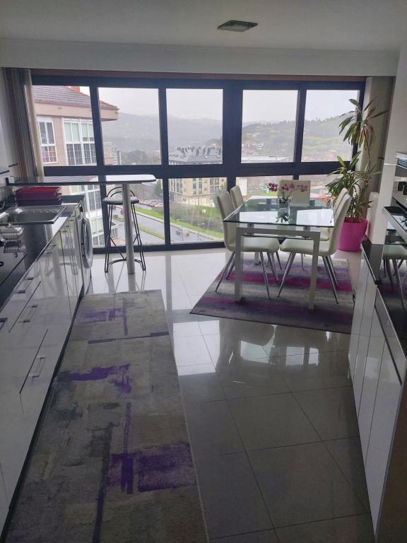 Kuchyň nebo kuchyňský kout v ubytování Duplex grandes cristaleras impresionantes vistas
