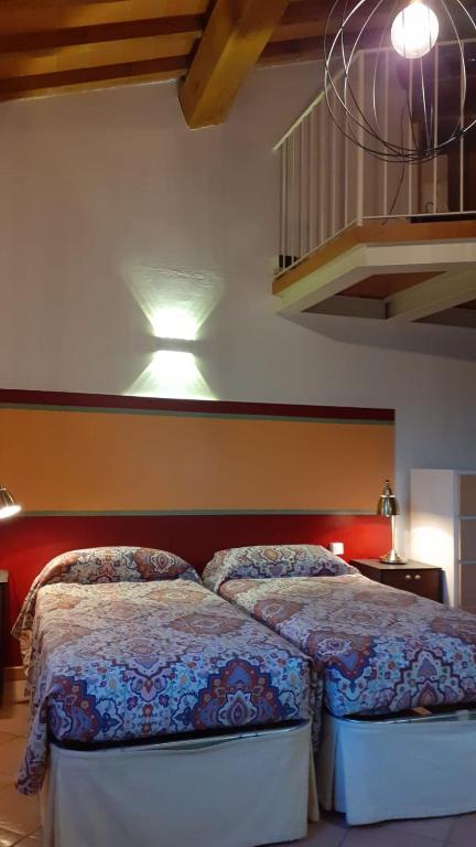 Postel nebo postele na pokoji v ubytování Agriturismo Podere Zollaio
