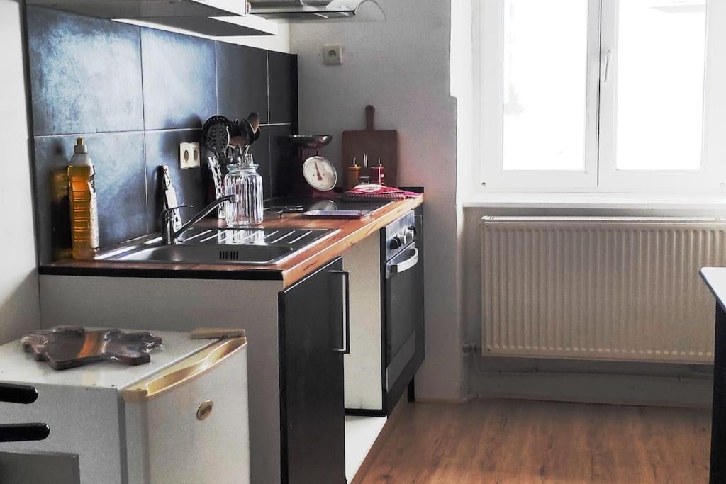 Kuchyň nebo kuchyňský kout v ubytování Appartement de caractère