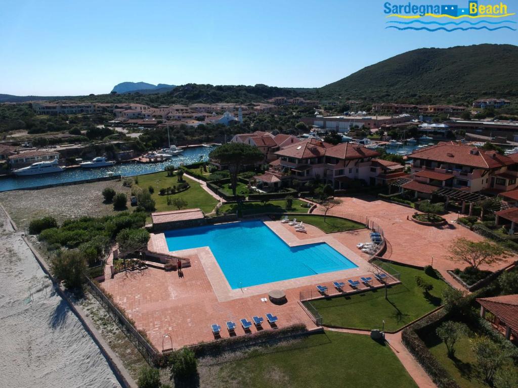 an aerial view of a house with a swimming pool at Sardegna Beach Cala Reale in Santa Marinella