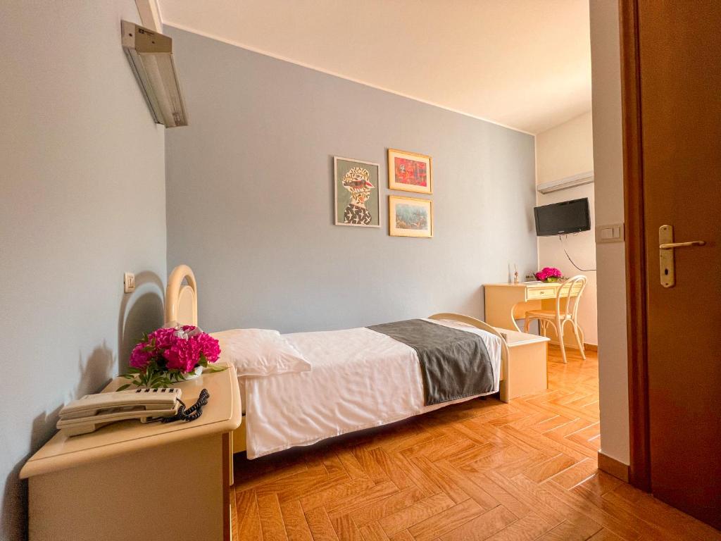 Postel nebo postele na pokoji v ubytování Albergo Ristorante Fratte