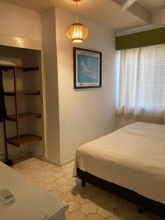 Postel nebo postele na pokoji v ubytování Villa Covadonga