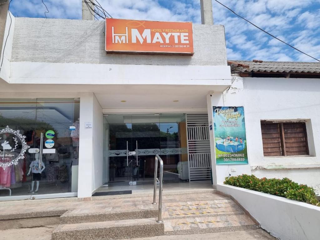 a store with a sign on the front of it at Hotel Mayte in Fonseca