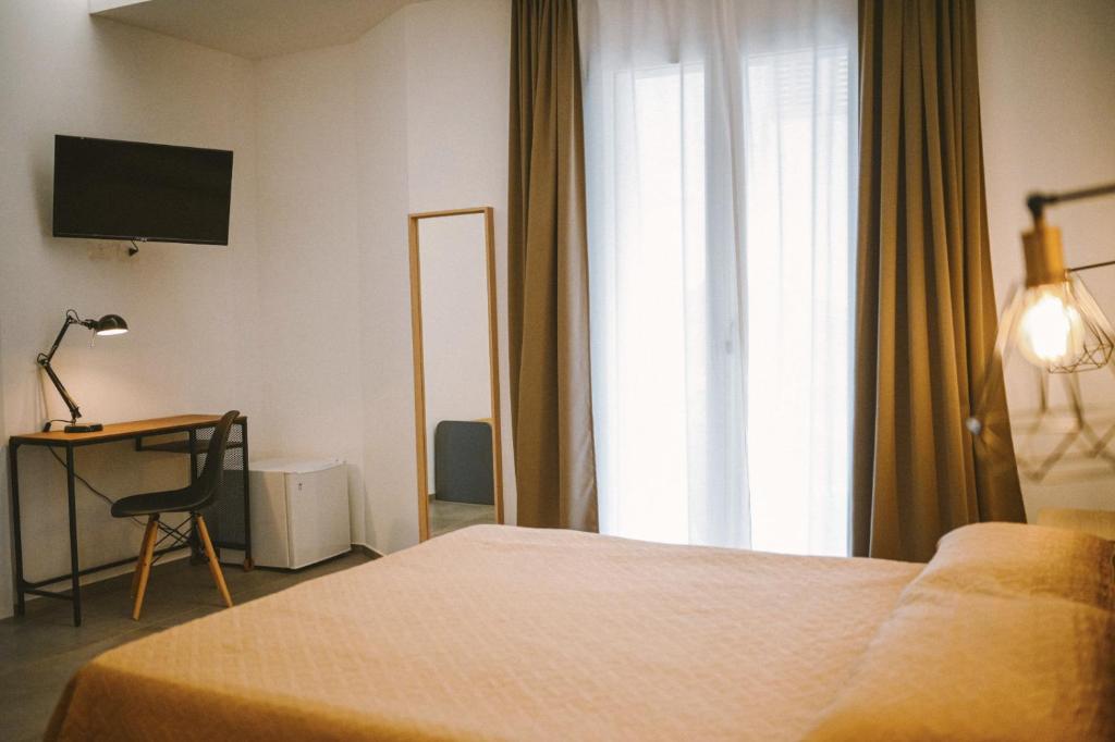 Postel nebo postele na pokoji v ubytování Olympus