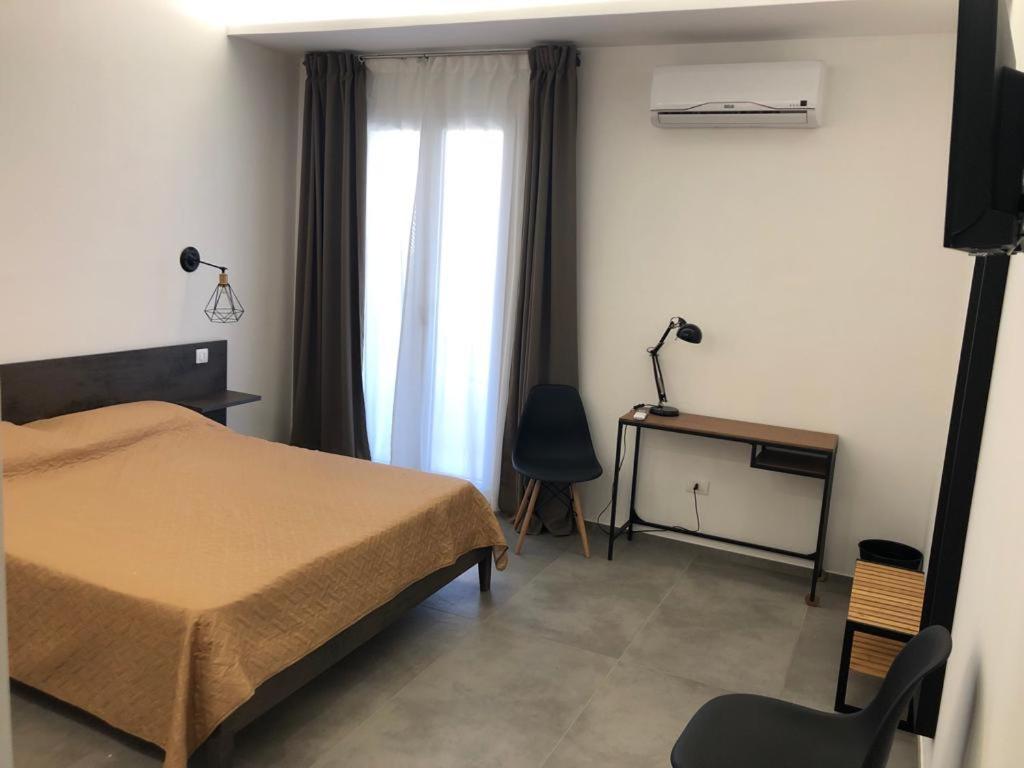 Postel nebo postele na pokoji v ubytování Olympus