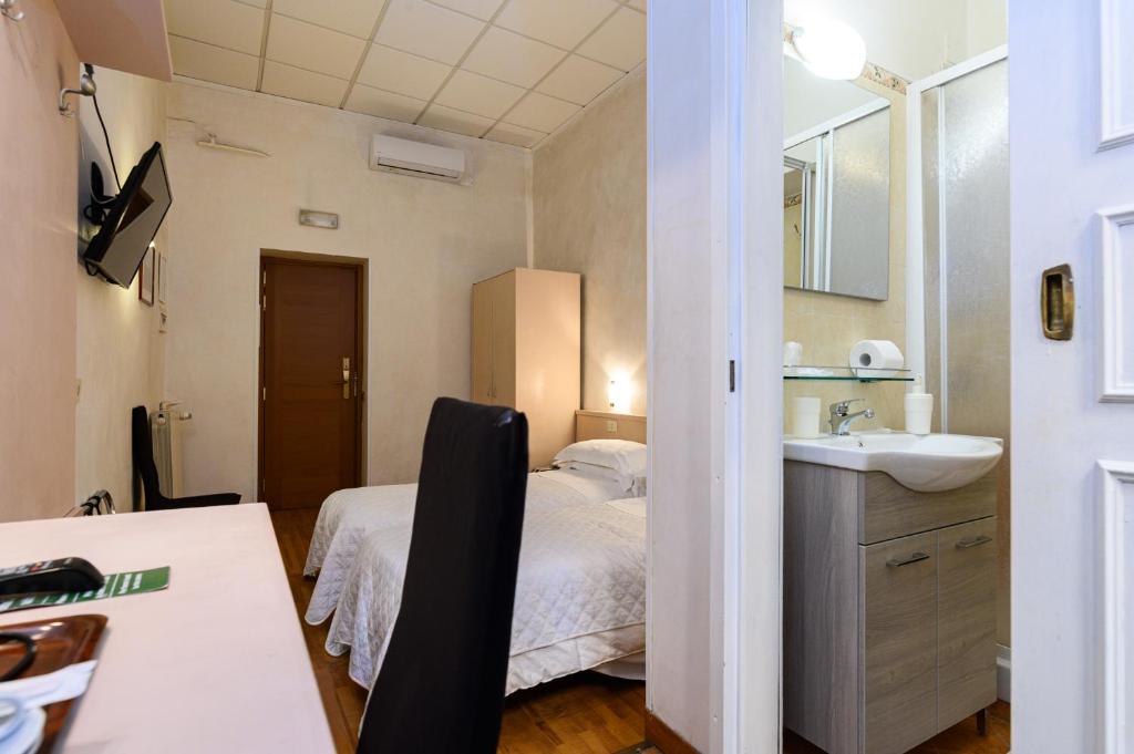 Ліжко або ліжка в номері Hotel Julia