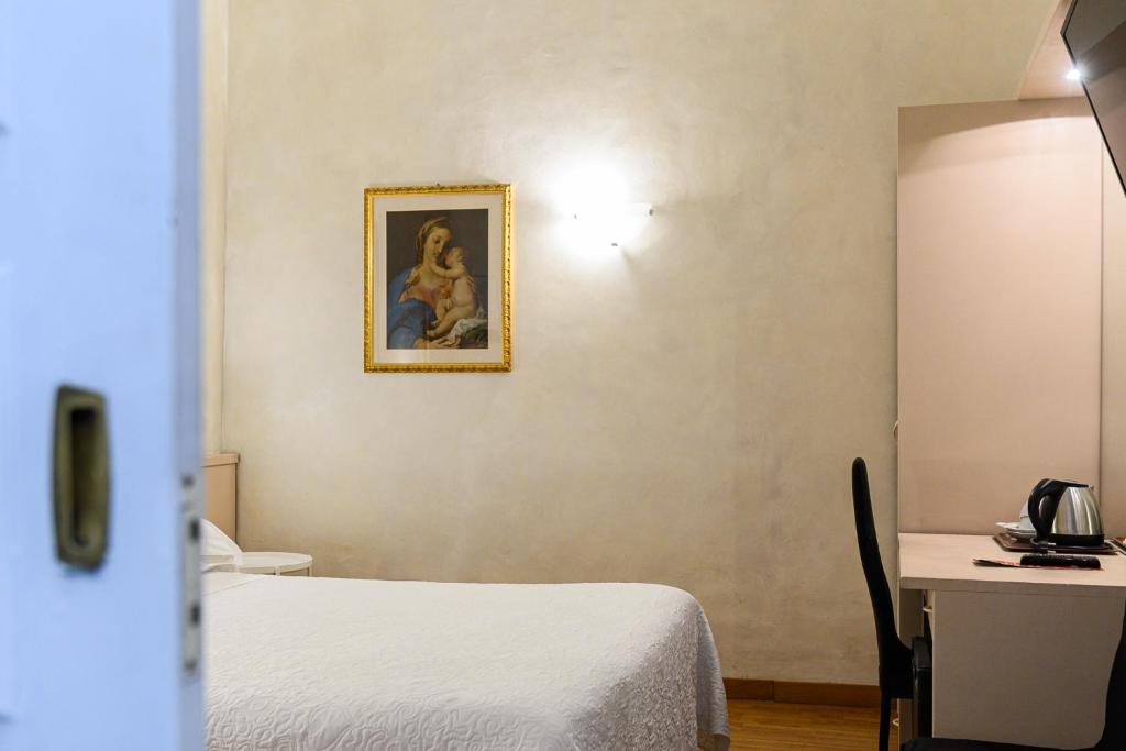 Ліжко або ліжка в номері Hotel Julia