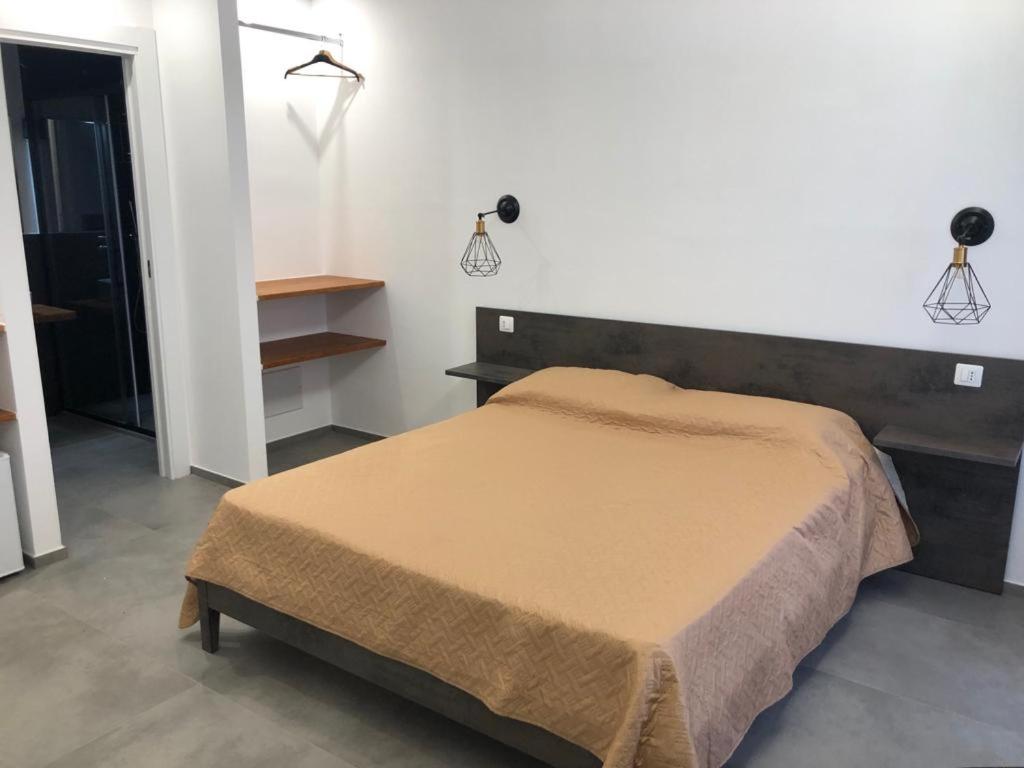 Postel nebo postele na pokoji v ubytování Olympus