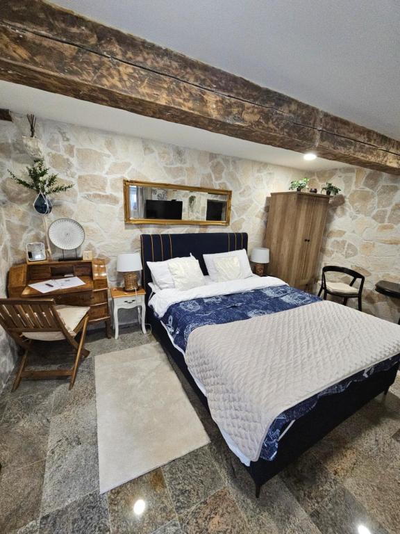 Posteľ alebo postele v izbe v ubytovaní Stone studio