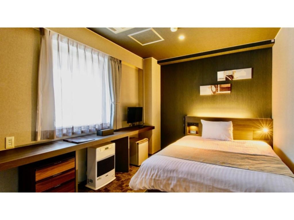 เตียงในห้องที่ Hotel Three M - Vacation STAY 93393v