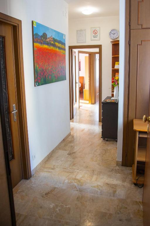 a hallway of a room with a painting on the wall at Venice Stefani Guesthouse in Marghera