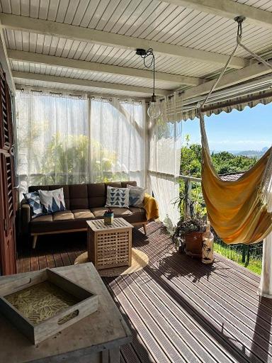 Posezení v ubytování Bungalow vue mer avec jardin