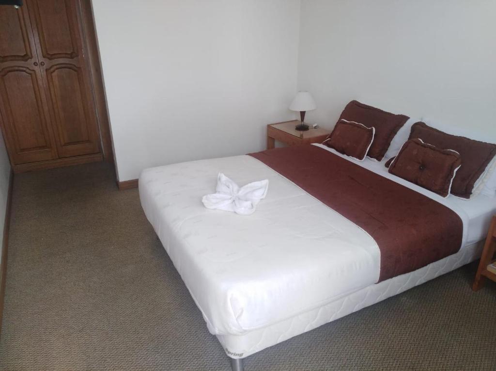 Postel nebo postele na pokoji v ubytování Hotel Casa La Riviera