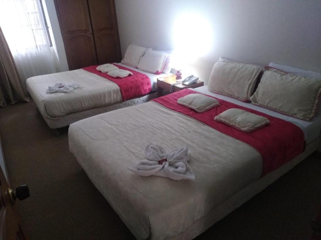 Postel nebo postele na pokoji v ubytování Hotel Casa La Riviera