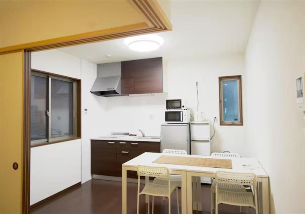 a kitchen with a table and chairs in it at [Kareki] - Vacation STAY 02612v in Kyoto